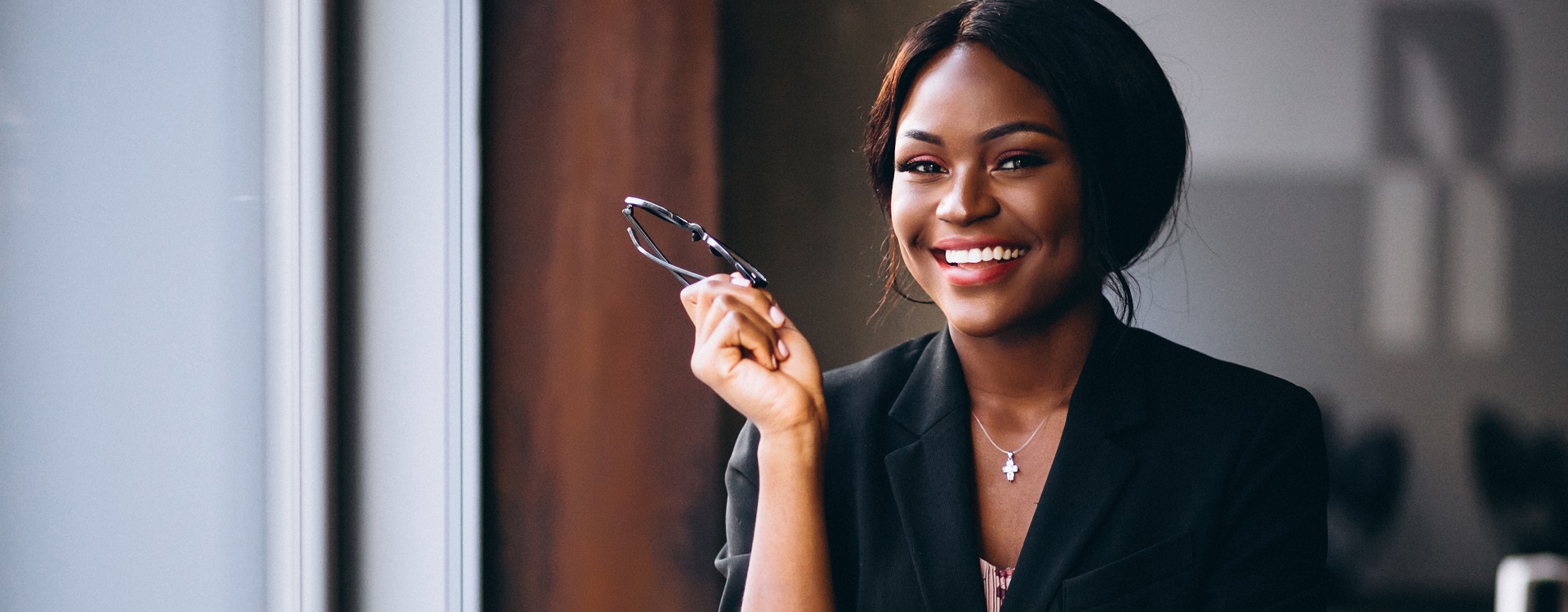 African american business woman by the window